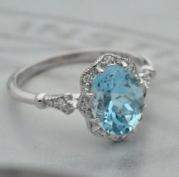 Aqua Marine Daisy oval halo engagement ring vintage inspired