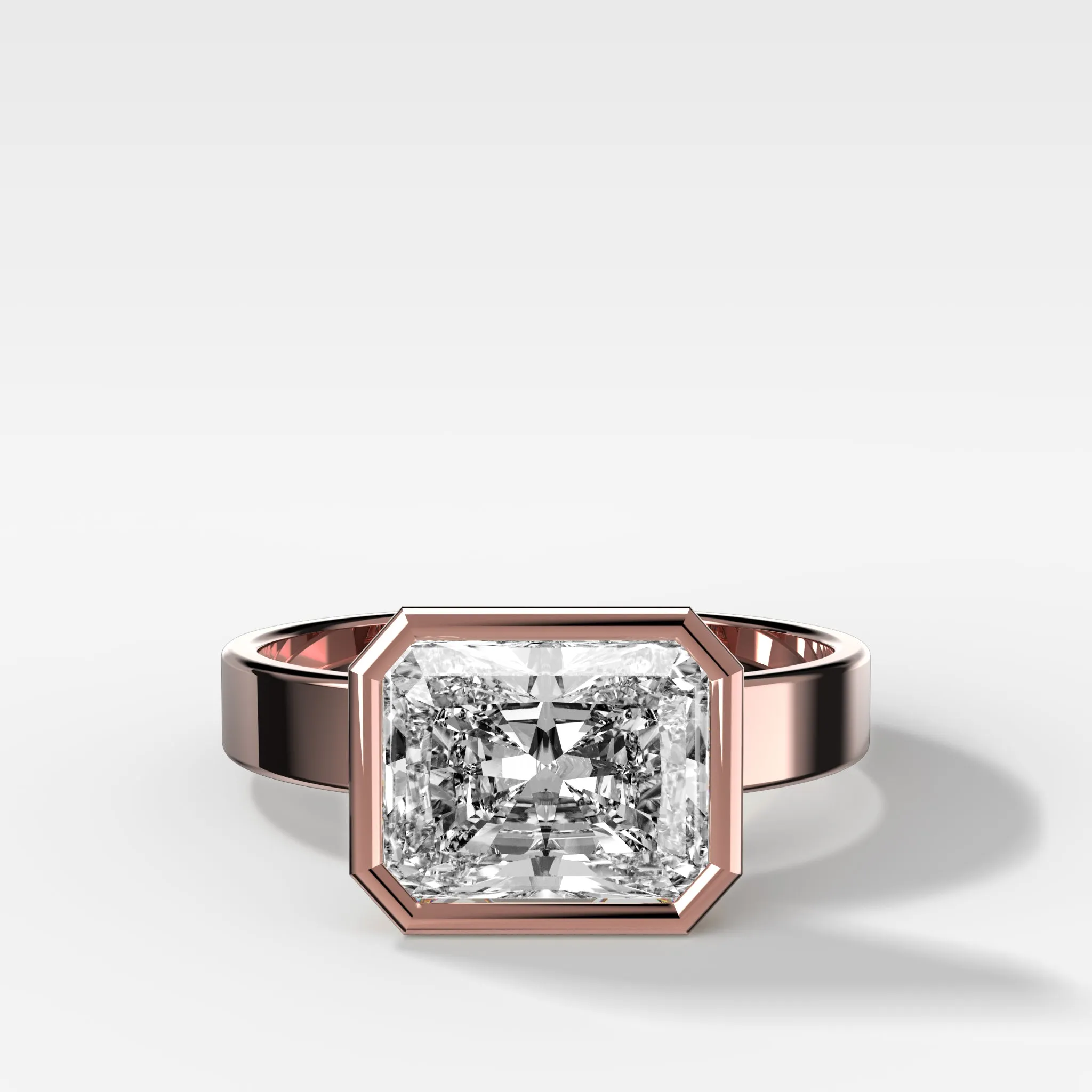 Finest Bezel Set Engagement Ring With East West Elongated Radiant Cut Diamond