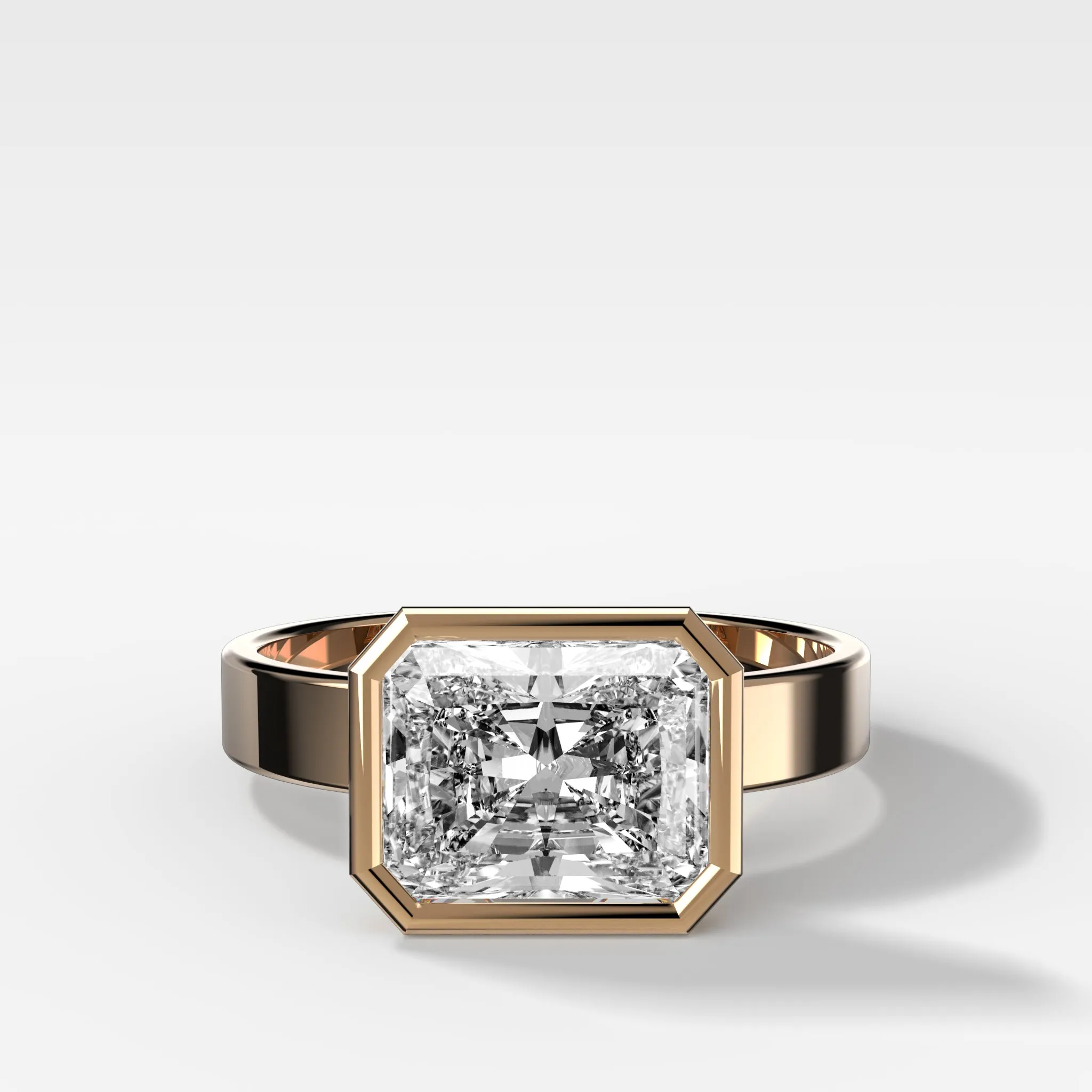 Finest Bezel Set Engagement Ring With East West Elongated Radiant Cut Diamond