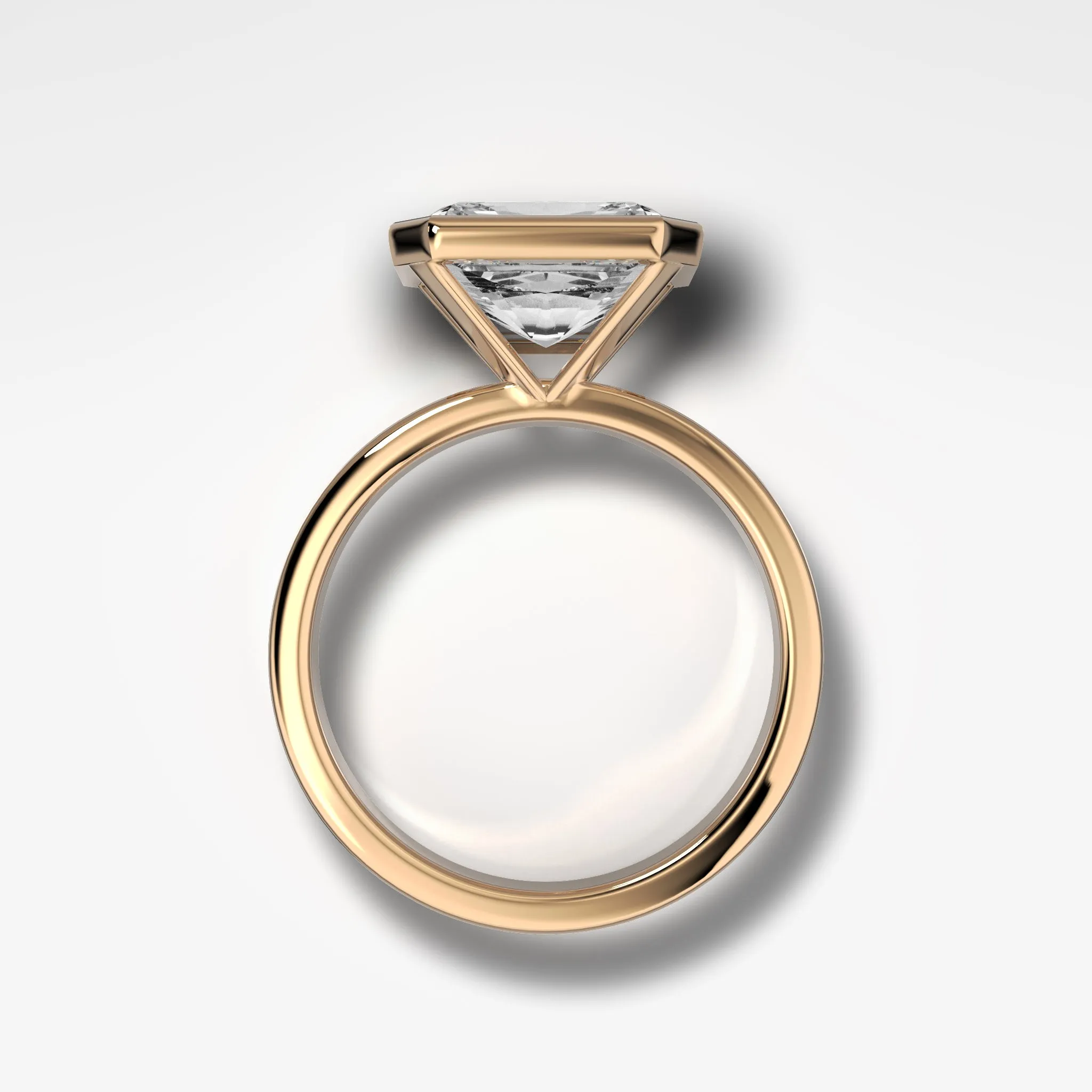 Finest Bezel Set Engagement Ring With East West Emerald Cut Diamond