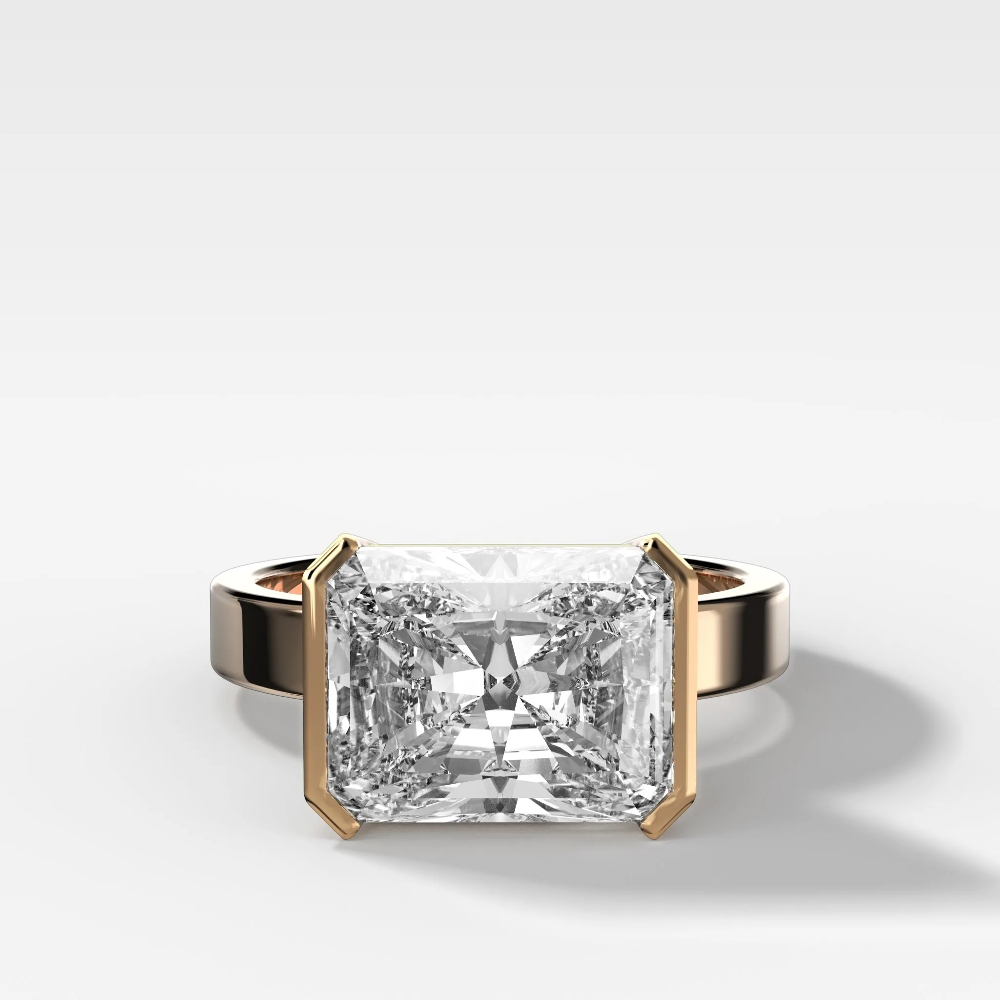 Finest Half Bezel Solitaire Engagement Ring With East West Elongated Radiant Cut Diamond