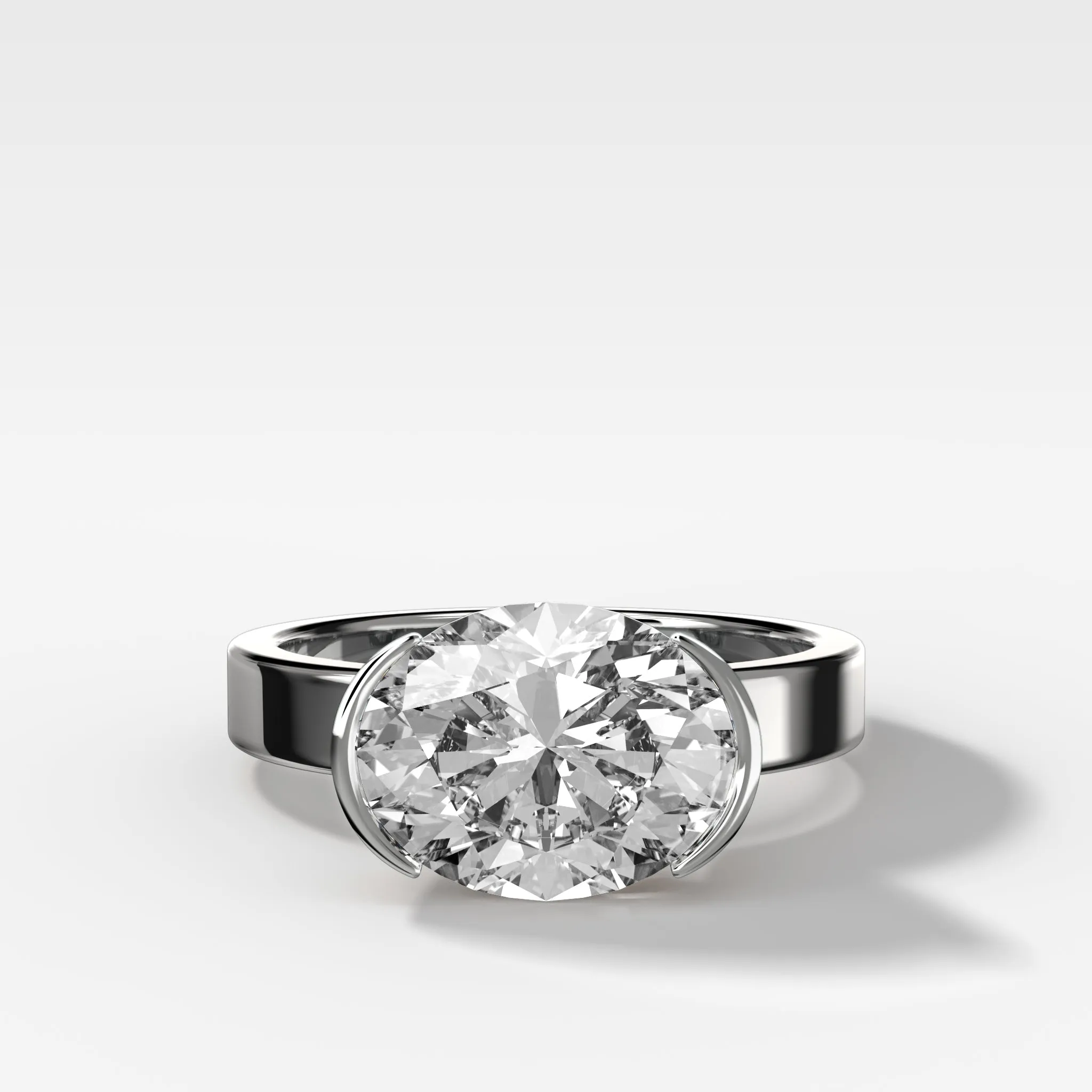 Finest Half Bezel Solitaire Engagement Ring With East West Oval Cut Diamond