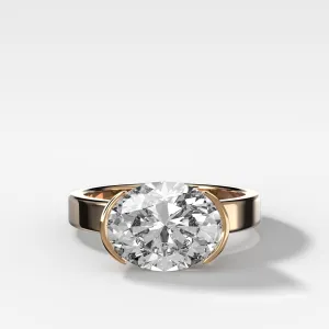 Finest Half Bezel Solitaire Engagement Ring With East West Oval Cut Diamond