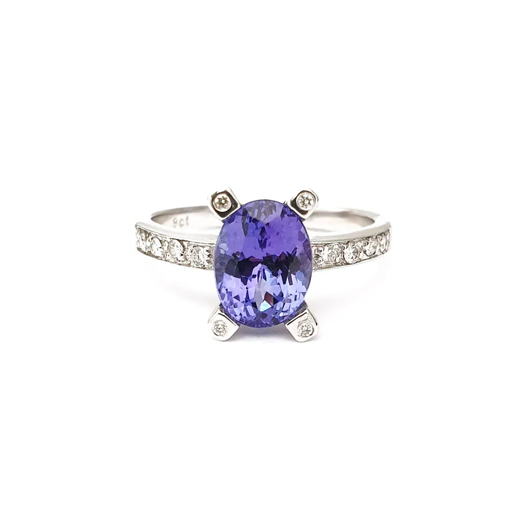 Oval Cut Solitaire Tanzanite Ring with Diamond Claw and Band Accents