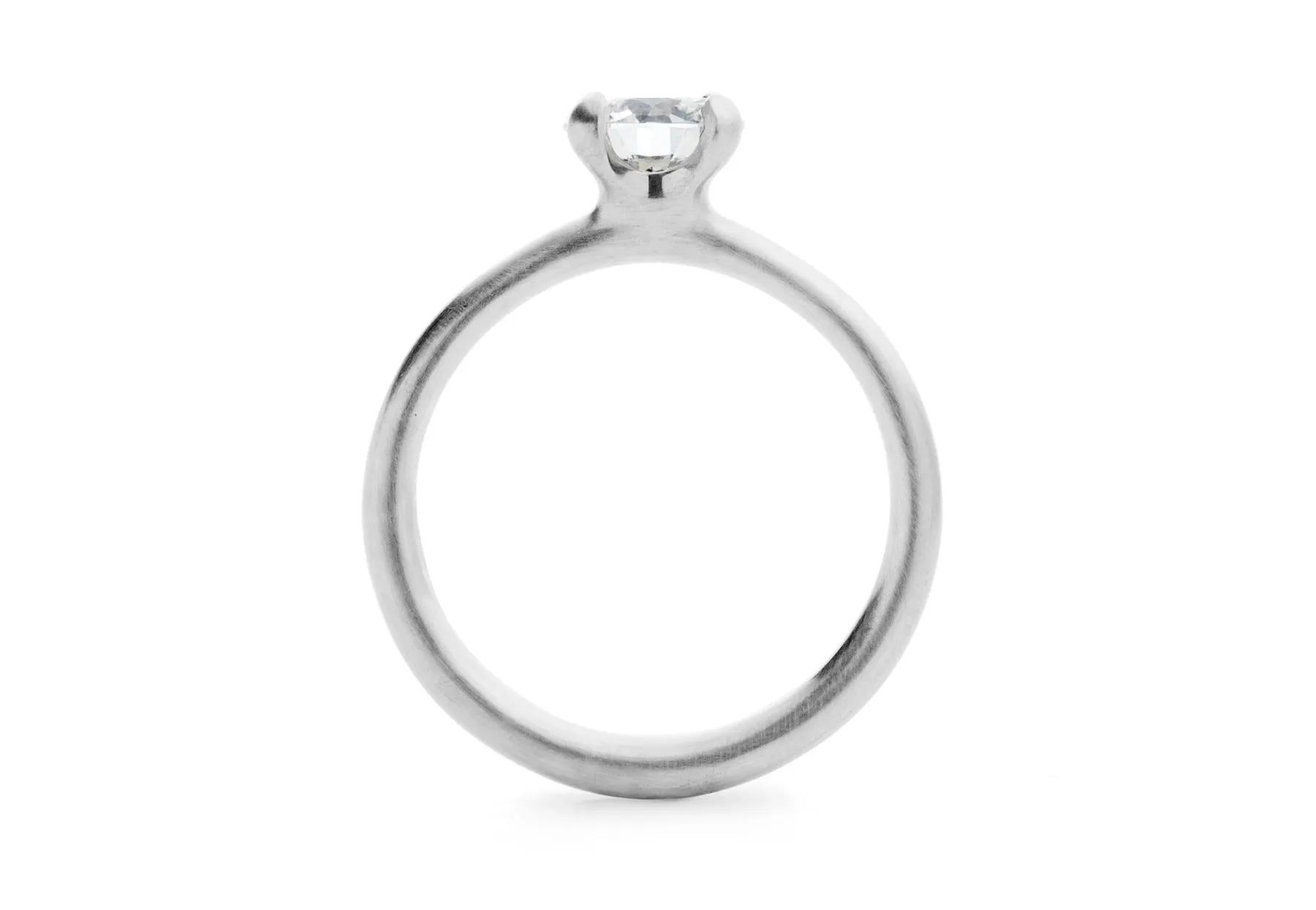 Oval diamond and platinum sculpted 4 claw engagement ring