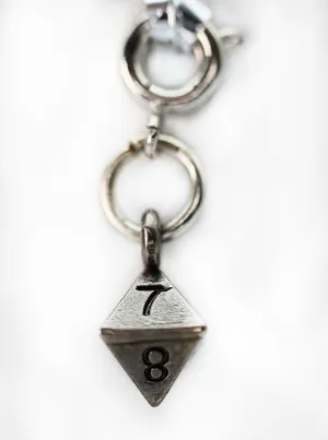 Traveler's Trinkets: D8 Charm
